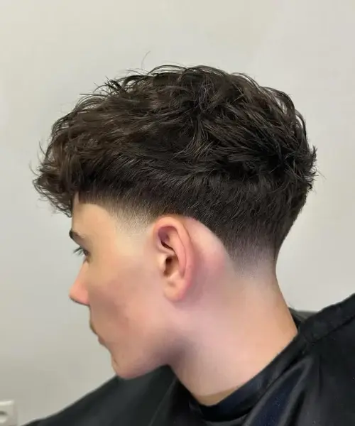 Low Taper Fade Haircut: Complete Guide for Men in 2025 11 Low Taper Fade with Fluffy Hair